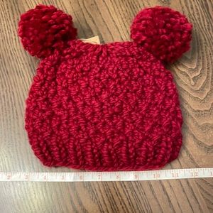 Handmade knitted double pom pom hat